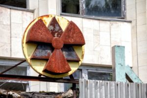 Radiation sign located on building at Chernobyl nuclear disaster site