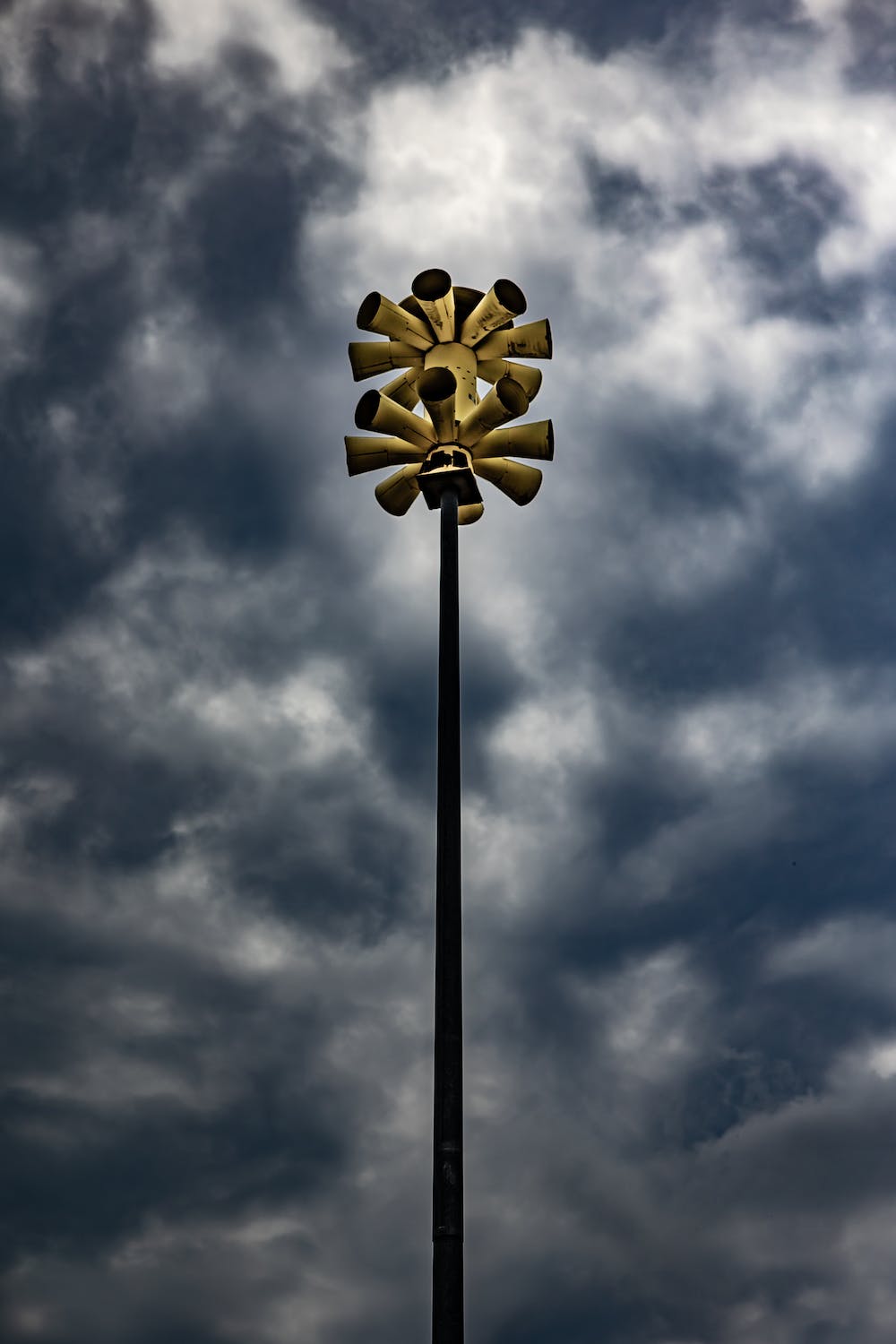 Tornado Siren with dark clouds in background