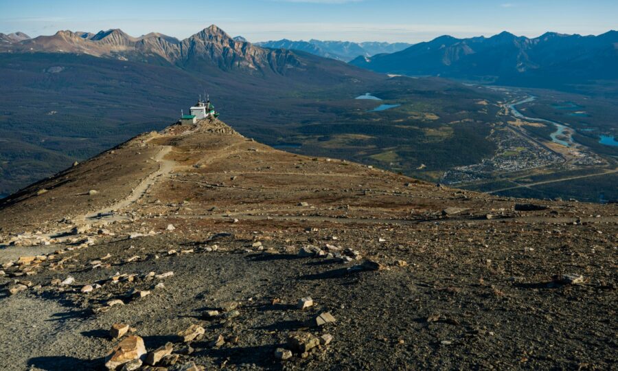 Mountain ridge rising above a valley town in the Canadian Rockies